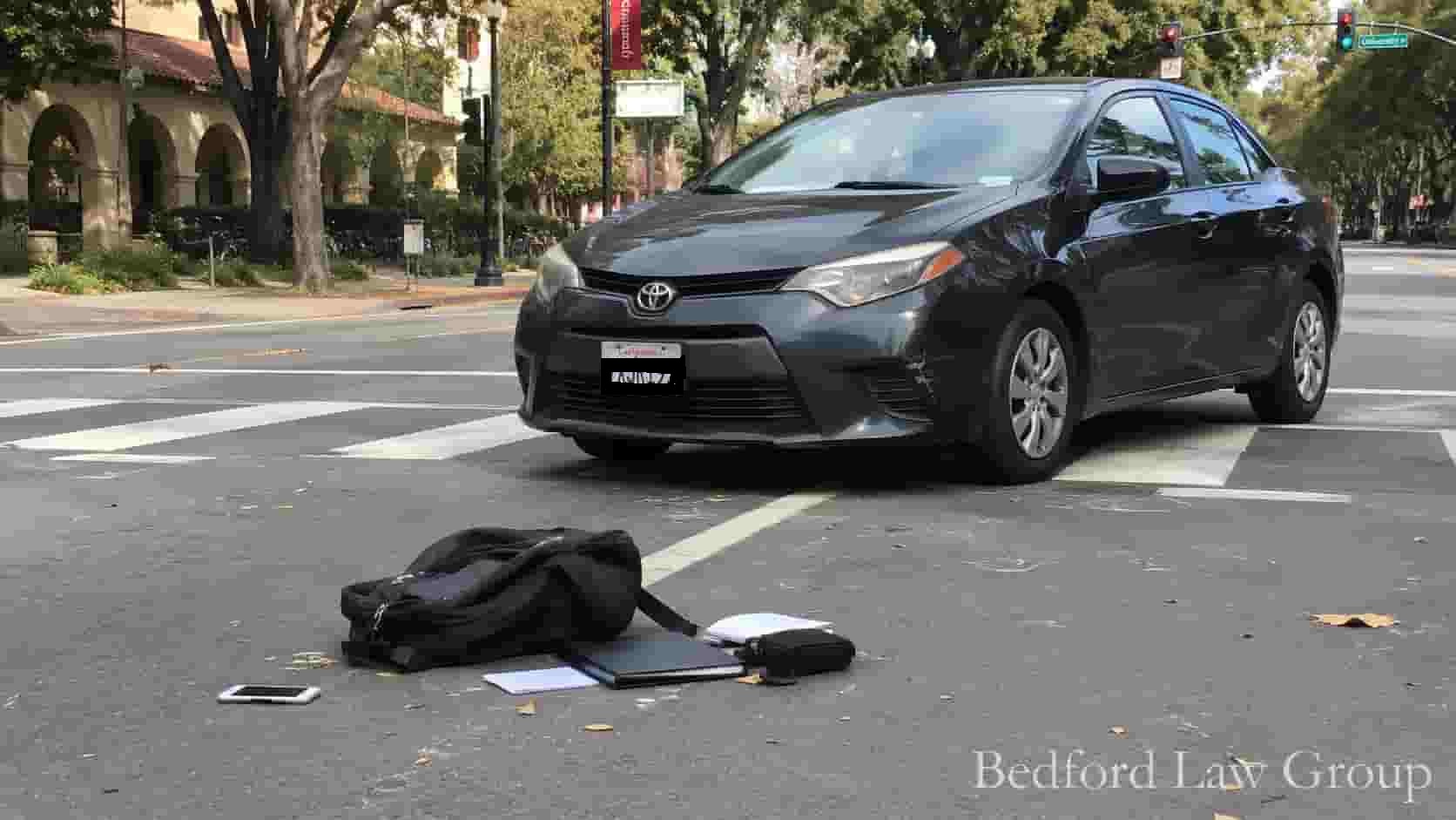 Real-world photo of a pedestrian accident scene at a crosswalk near Stanford University in Palo Alto, managed by Bedford Law Group injury attorneys